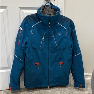 Spyder Blue and Red Ski Jacket with High Collar and Water-Resistant Fabric